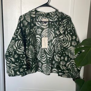 Never been worn, one size fits most cover up.